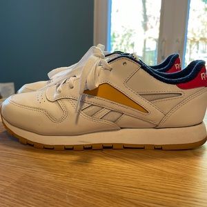Reebok classic sneakers with primary colour details.